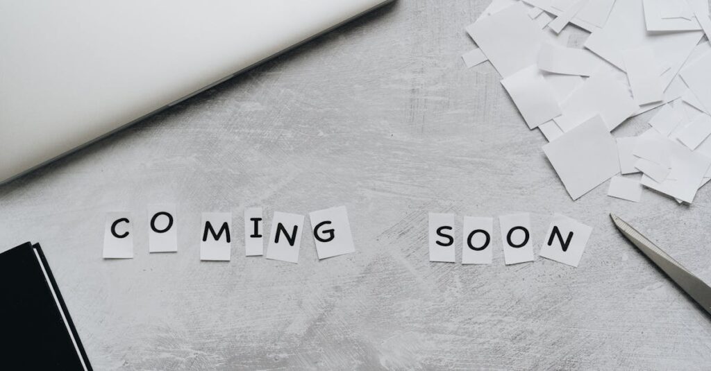 A creative arrangement with paper cutouts spelling 'Coming Soon' on a textured surface.